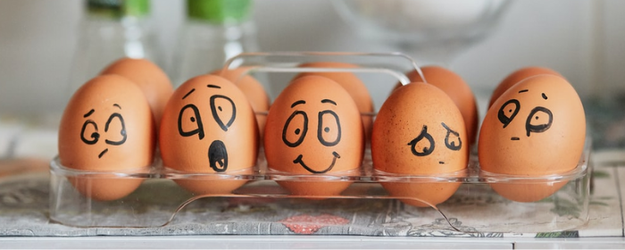 Words are like eggs: some are happy, some are sad.  (Image from Tengyart/unsplash.com.)
